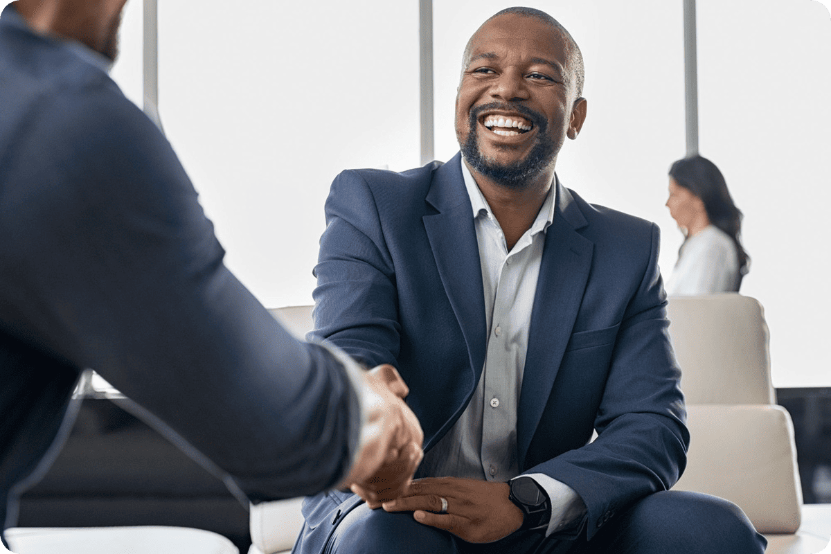 man in suit shaking hands